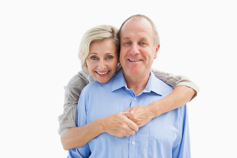 older woman hugging man from behind