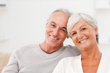 older man and woman smiling