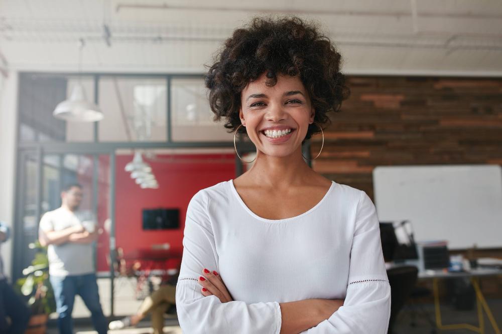 woman with a bright smile working in an Alpharetta office