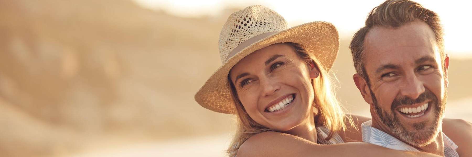 A couple smiling after cosmetic dentistry in Alpharetta Creek Restorative Dentistry