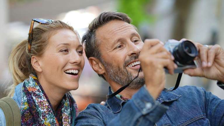 A couple taking a selfie after cosmetic dentistry in Alpharetta Creek Restorative Dentistry
