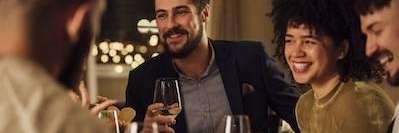 man and woman smiling at a dinner party in Alpharetta